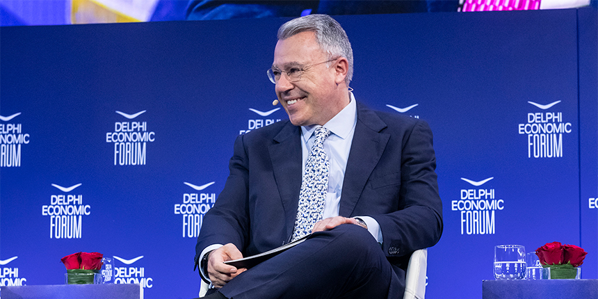 Alpha Bank Group CEO, Vassilis Psaltis, smiling during a discussion at the Delphi Economic Forum.