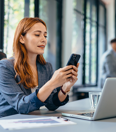 woman with mobile phone and laptop