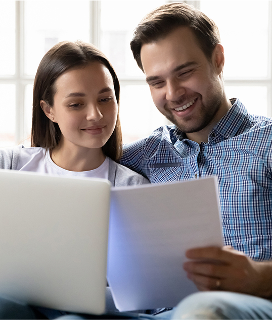 couple with laptop and papers